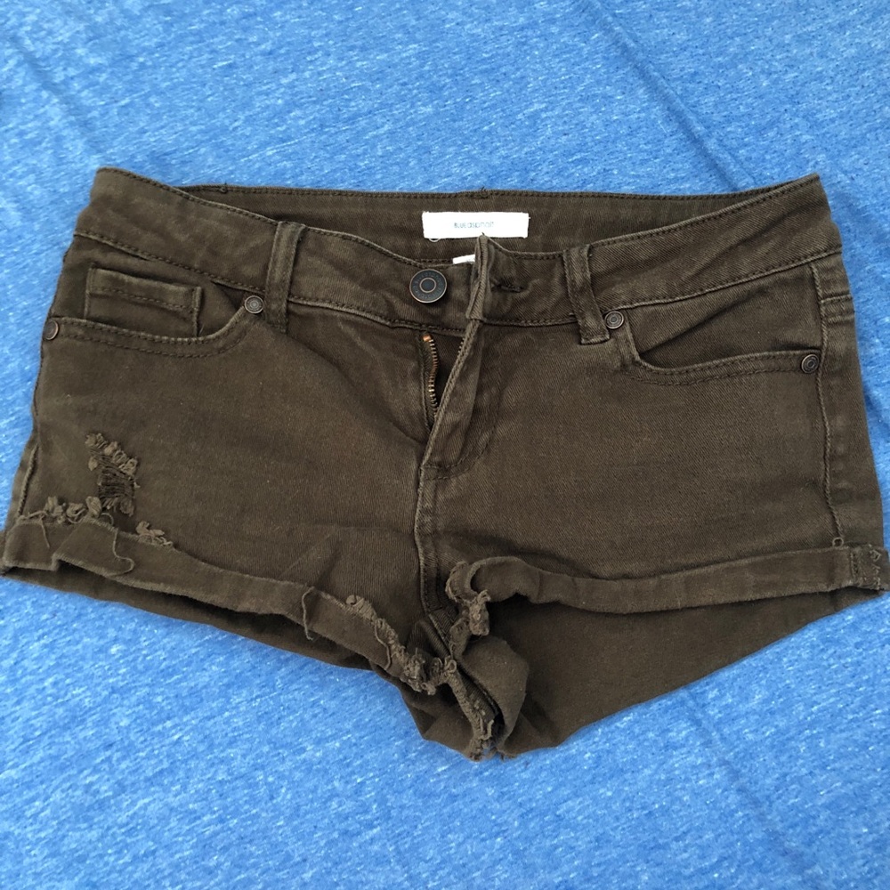 Dark green ripped jean shorts
